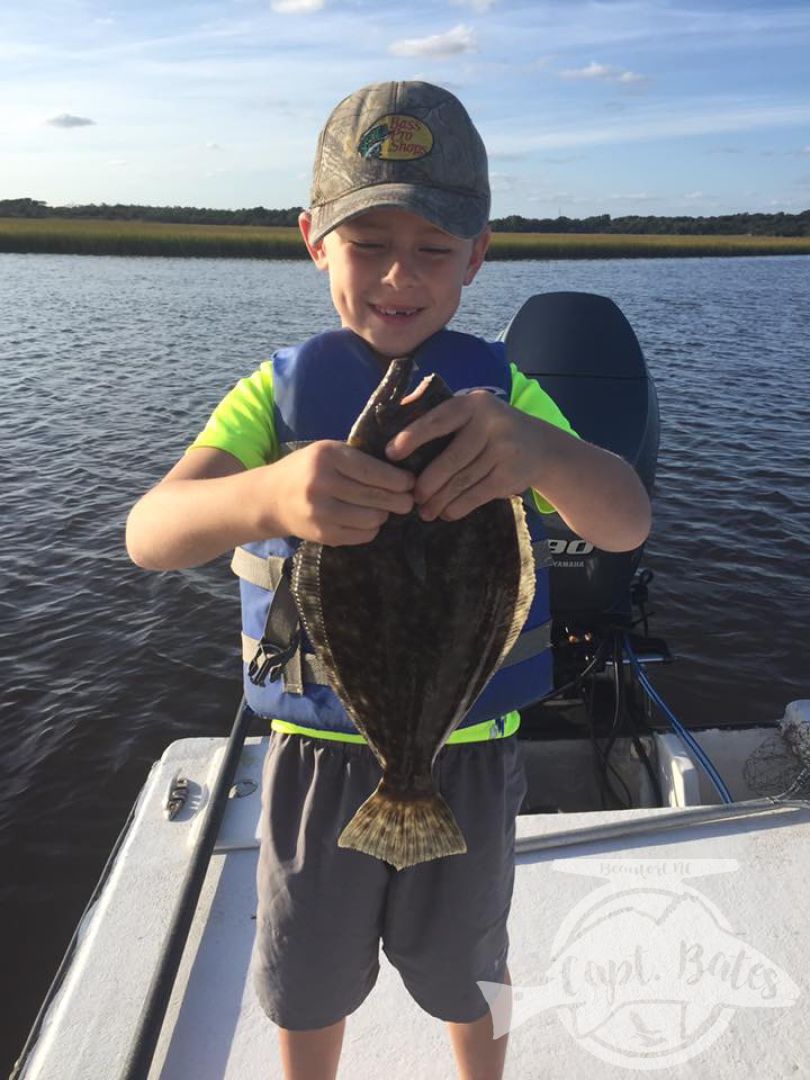 Not sure if hes smiling at fish, or licking his lips thinking bout a sammich!