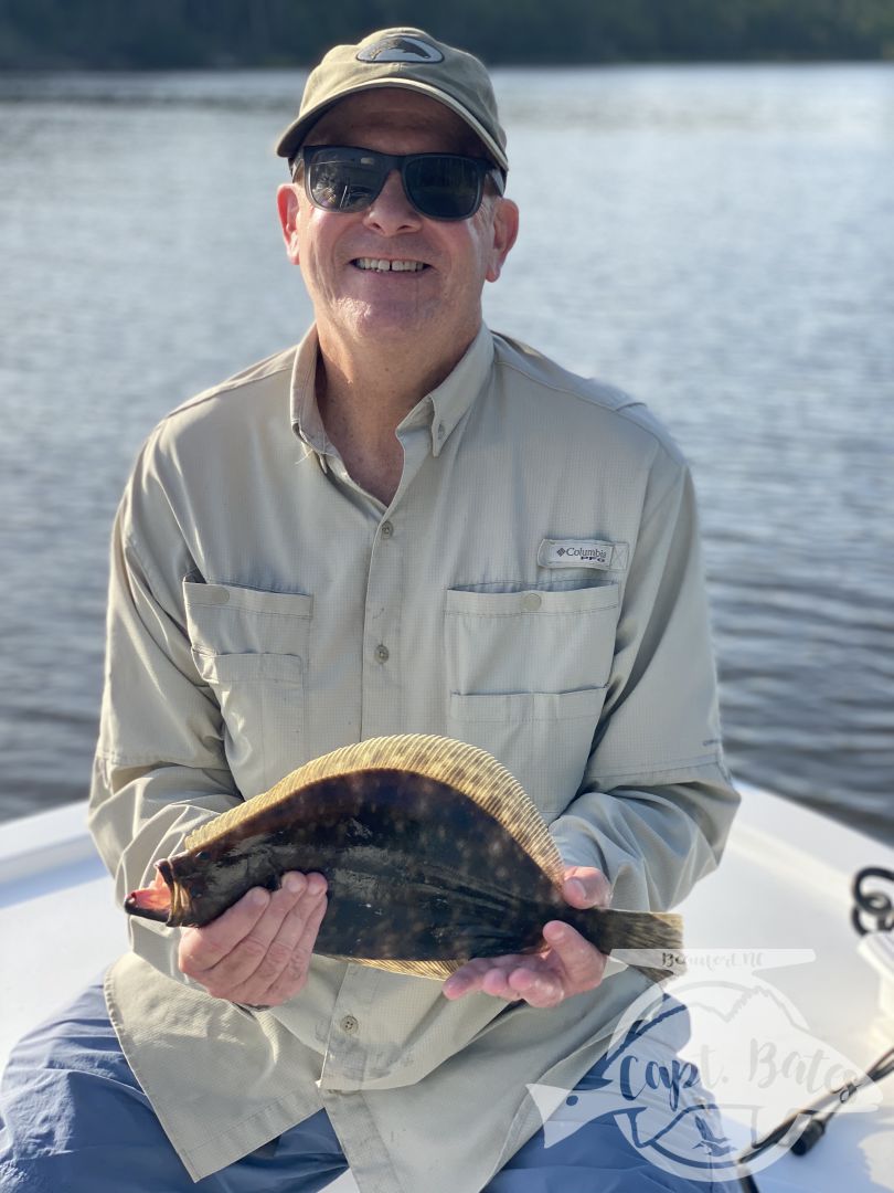 Another blow day with a fine couple catching reds and flounders!