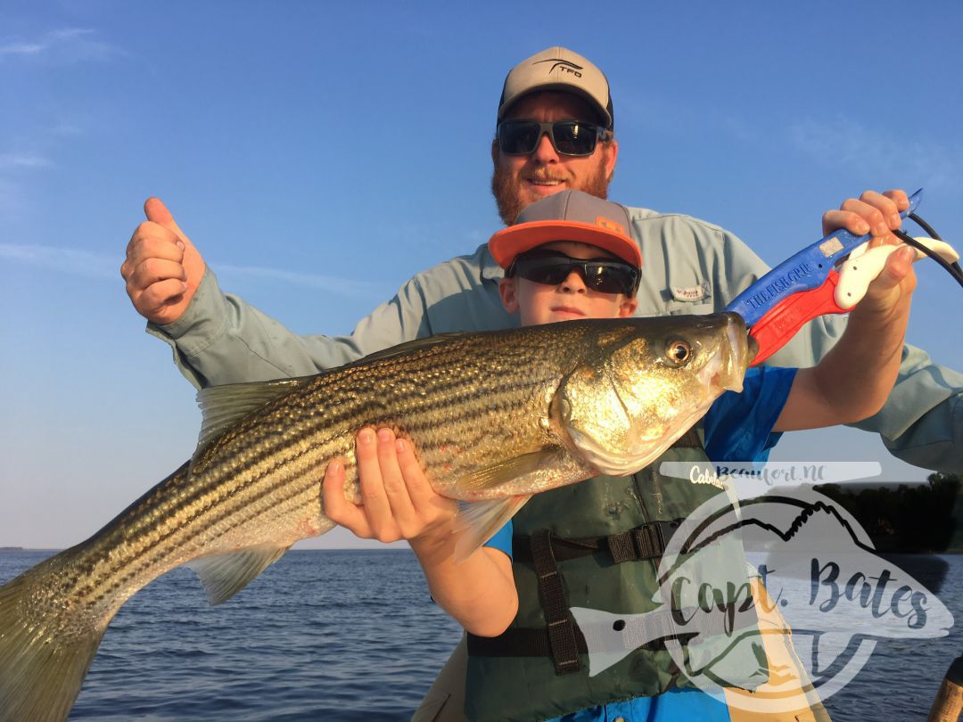 Troy Troy with a hawg of a rockfish! Topwater on the Neuse River in North Carolina can be incredible!